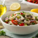 Bowl of vibrant scungilli salad garnished with parsley