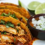 Chicken birria tacos with lime and dipping broth