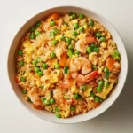 Bowl of vibrant shrimp fried rice with green onions