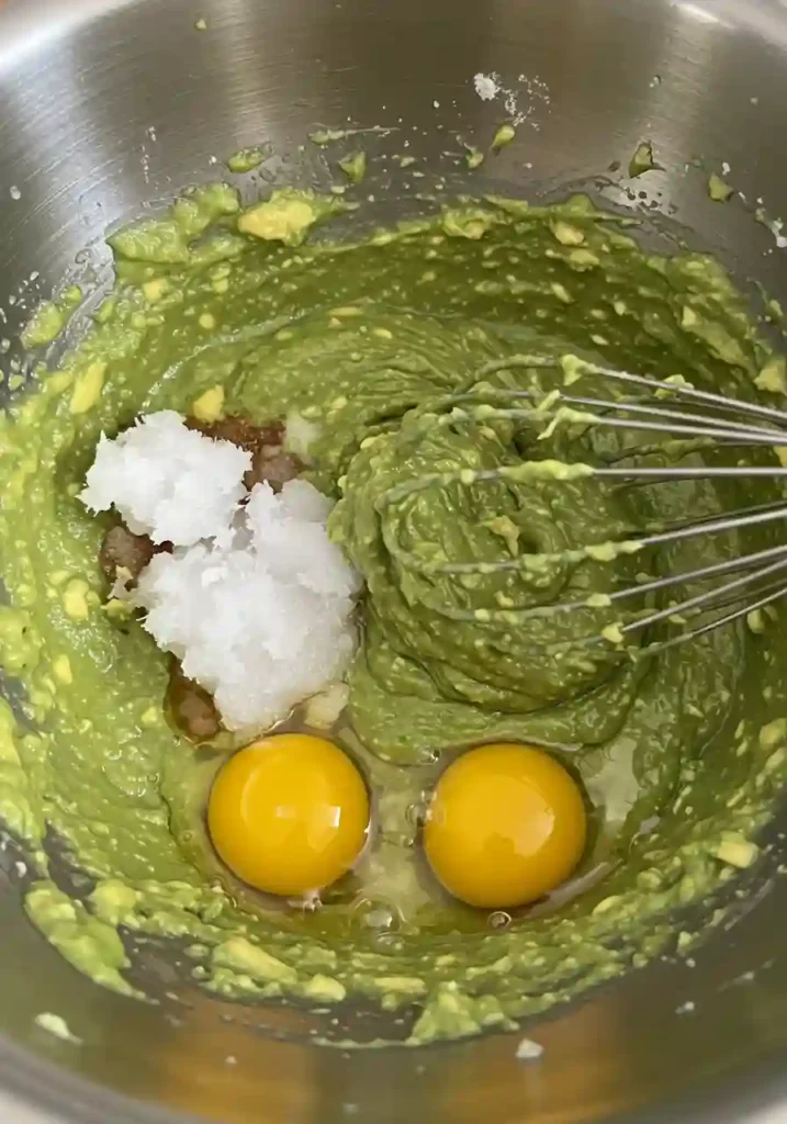 Smooth avocado mixture in a bowl for brownie batter