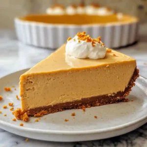 Sliced no bake pumpkin cheesecake with whipped topping