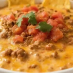 Bowl of hot Rotel dip with ground beef and tortilla chips