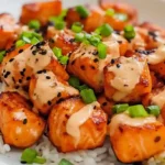 Air-fried salmon bites drizzled with bang bang sauce