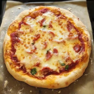 Sliced gluten free pizza dough with toppings on parchment