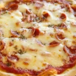 Baked gluten free pizza crust fresh out of the oven