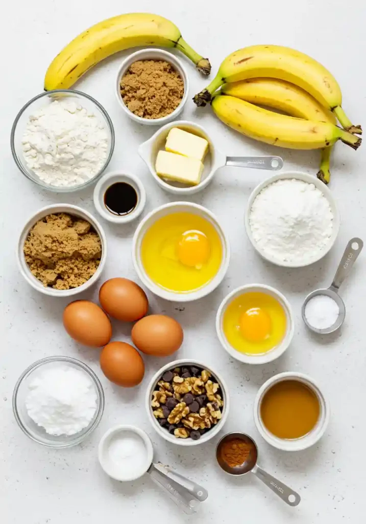 Bananas, gluten-free flour, eggs, and other ingredients on a table