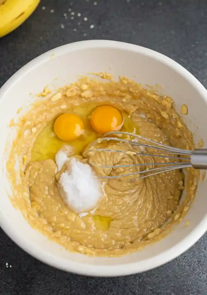 Whisking bananas, eggs, and milk for gluten free batter