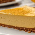 Whole no bake pumpkin cheesecake topped with whipped cream