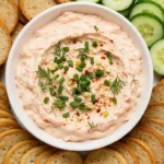 Bowl of creamy smoked salmon dip with crackers