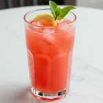 Chilled watermelon lemonade served with lemon slice and mint