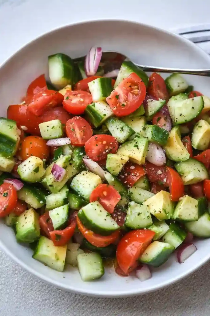 Fresh cucumber, tomato, avocado, and herbs mixed with dressing