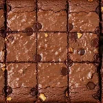 Rich and fudgy gluten free brownie on a cooling rack