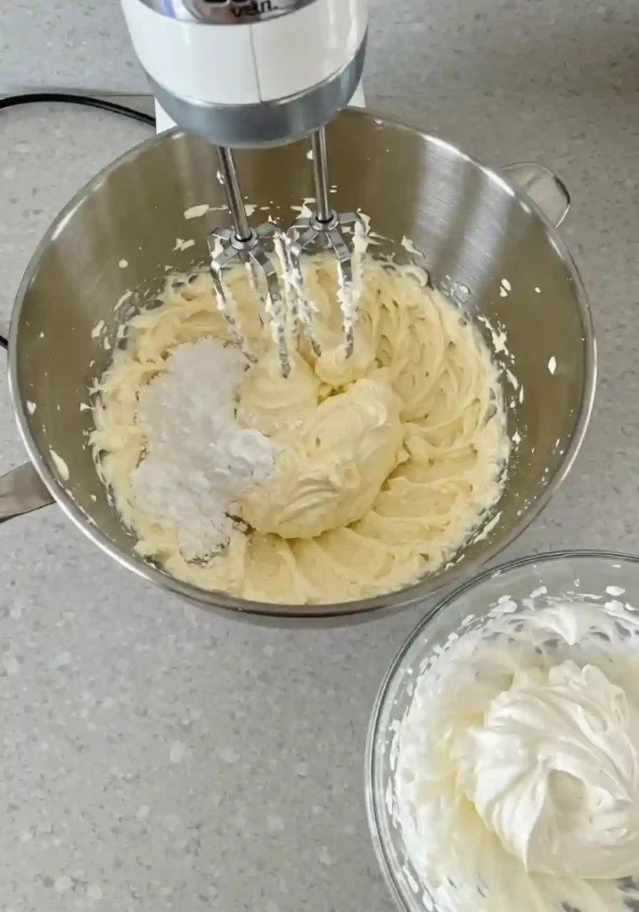 Whipping Cream Cheese, Sugar, and Lemon for Smooth Cheesecake Filling