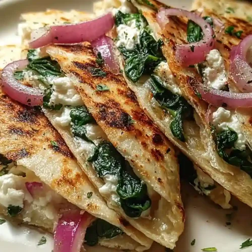 Mediterranean Quesadillas with Spinach Feta Mozzarella and Red Onion